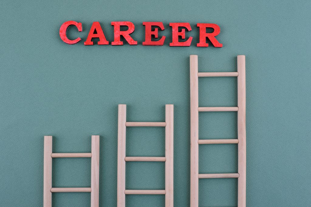 Career ladder concept with wooden stairs